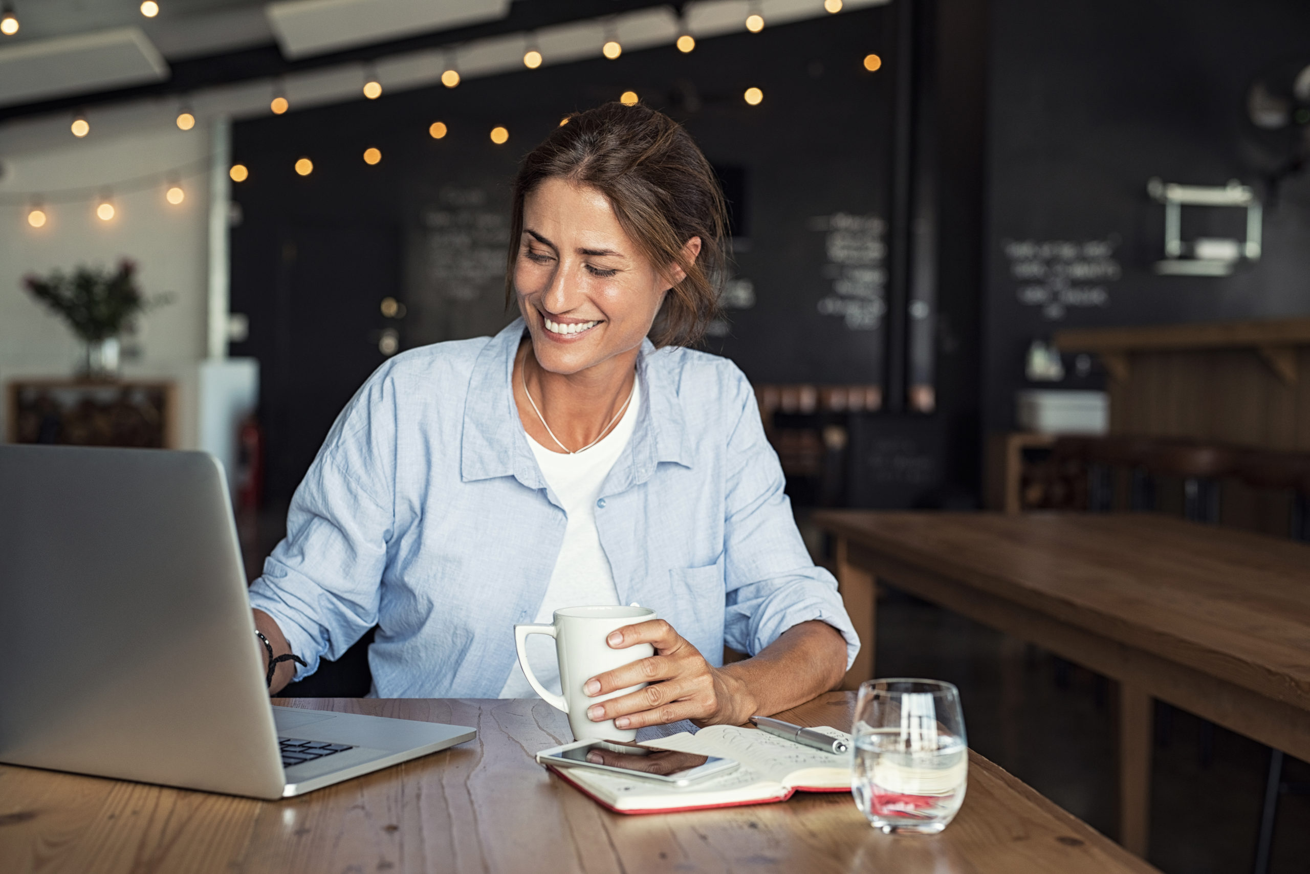 smiling woman with a laptop