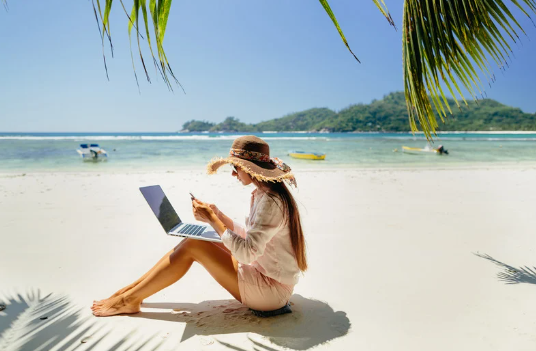 Screenshot 2025-02-23 173544 - WOMAN ON BEACH WITH LAPTOP