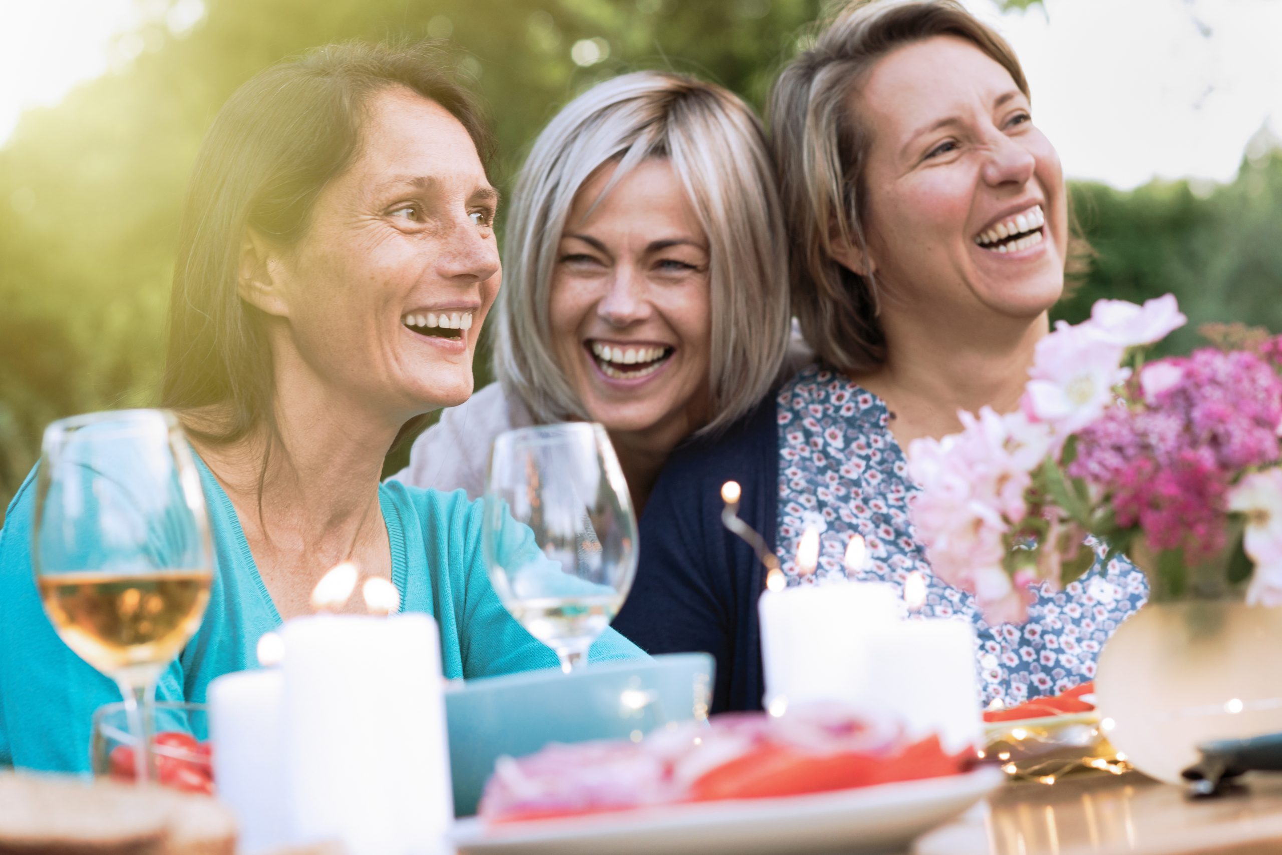 Three,Female,Friends,In,Their,40s,Share,A,Moment,Of